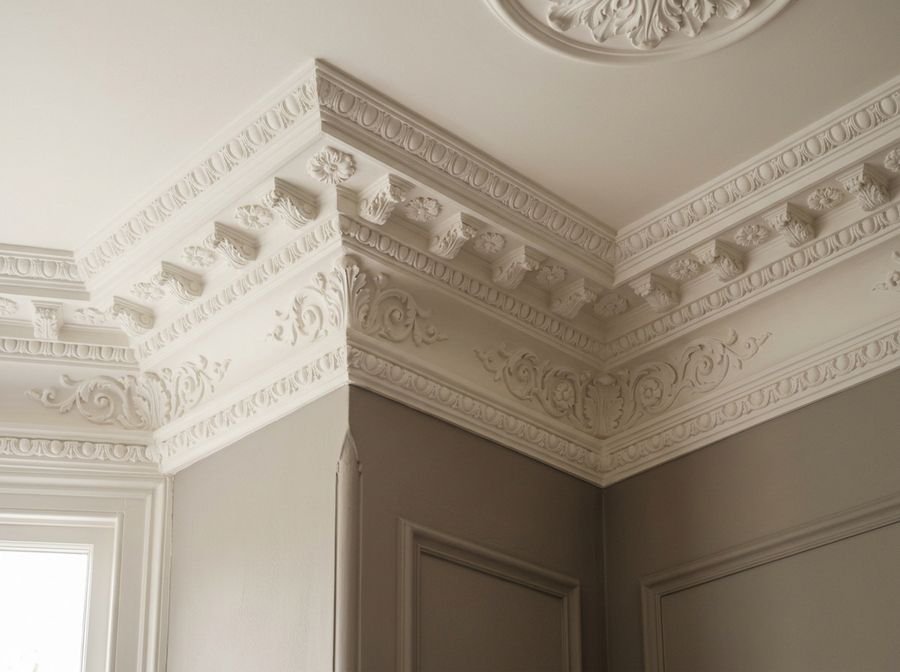 Detailed ornate cornice painted in white